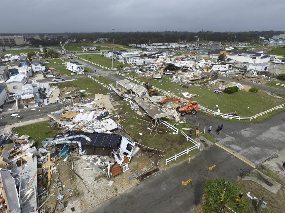 Emerald Isle town employees work to clear the road after a tornado hit Emerald Isle N.C. as Hurricane Dorian moved up the East coast on Thursday, Sept. 5, 2019. (Photo: Tom Copeland/AP)