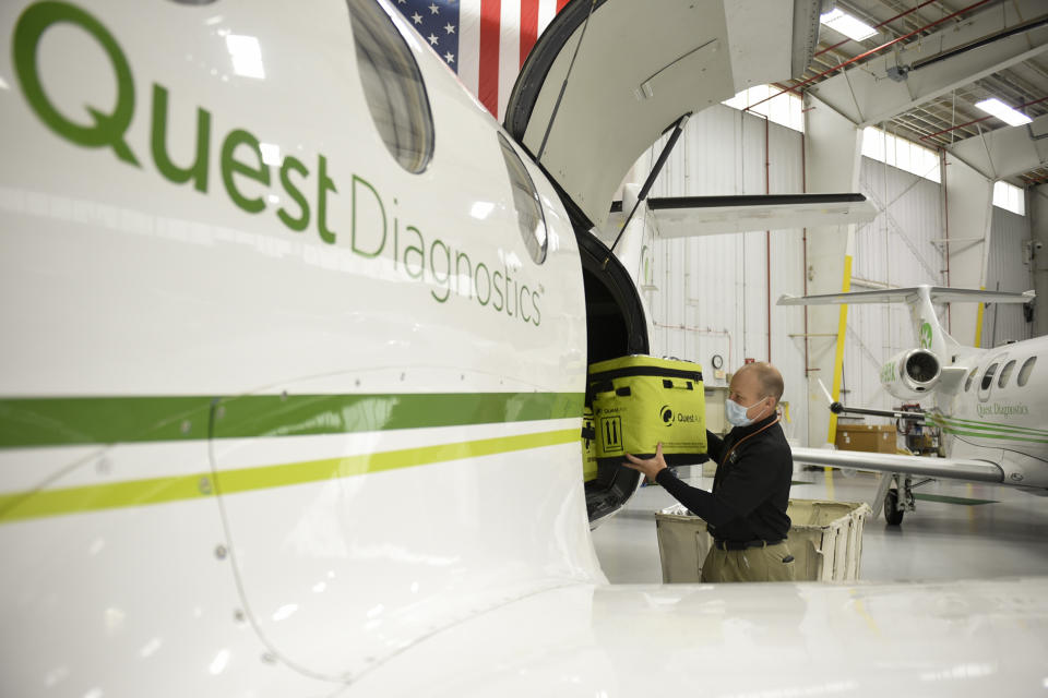 Bern Township, PA - April 24: Scott Borton, national air logistics manager, loads samples into a plane at the Quest Diagnostics hangar at the Reading Airport on Friday, April 24, 2020. Most of the specimens they are transporting for testing are cornavirus / COVID-19 tests. (Photo by Lauren A. Little/MediaNews Group/Reading Eagle via Getty Images)