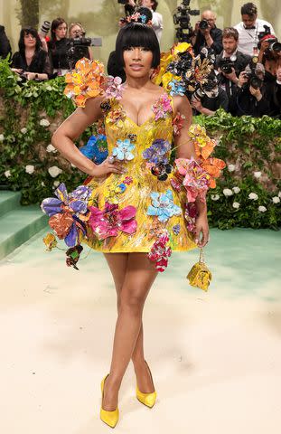 <p>John Shearer/WireImage</p> Nicki Minaj wears a custom Marni dress at the 2024 Met Gala on May 6, 2024