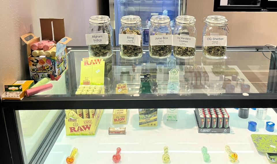 Glass counters display different types of cannabis products that can be purchased at Flower Shop Dispensary in Sioux Falls on Sept. 5, 2022.