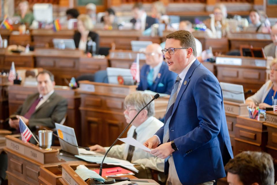 State Rep. Taylor Collins, R-Mediapolis, speaks from the House floor at the Iowa State Capitol, Monday, May 1, 2023.