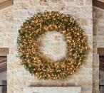 <p>potterybarn.com</p><p><strong>$479.00</strong></p><p>This artificial Aspen Spruce wreath includes pre-lit lights to make decorating as simple as possible. </p>