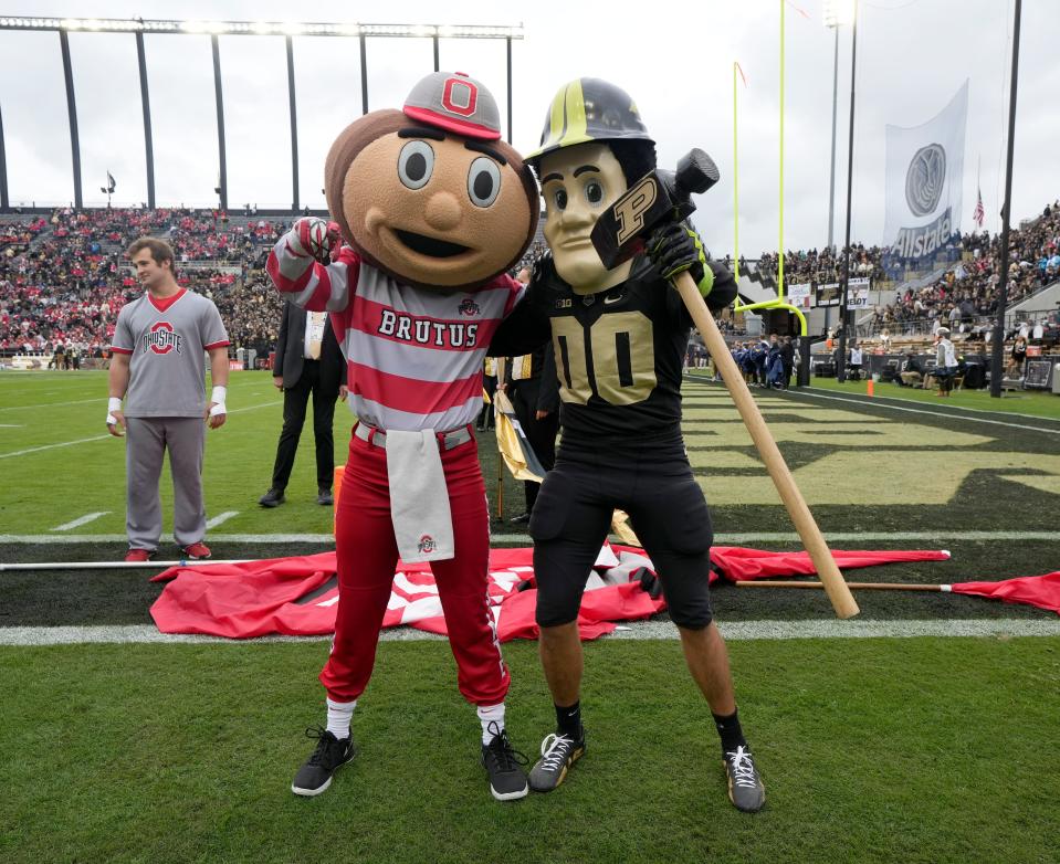 Oct. 14, 2023; Lafayette, In., USA; 
Brutus Buckeye and Purdue Pete pose for a photo before Saturday's NCAA Division I football game between the Ohio State Buckeyes and the Purdue Boilermakers at Ross-Ade Stadium in Lafayette.
