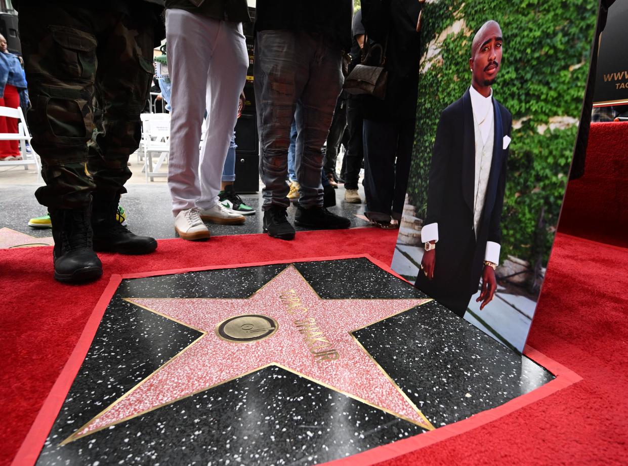 A portrait of US rapper Tupac Shakur is displayed at his unveiled star on the Hollywood Walk of Fame ceremony in Hollywood, California, on June 7, 2023. (AFP via Getty Images)