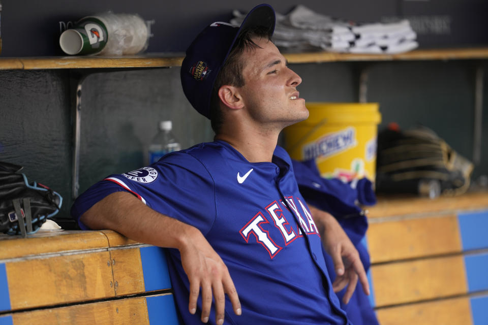 Texas Rangers pitcher Jack Leiter watches from the dugout after being pulled against the Detroit Tigers in the fourth inning of a baseball game, Thursday, April 18, 2024, in Detroit. (AP Photo/Paul Sancya)