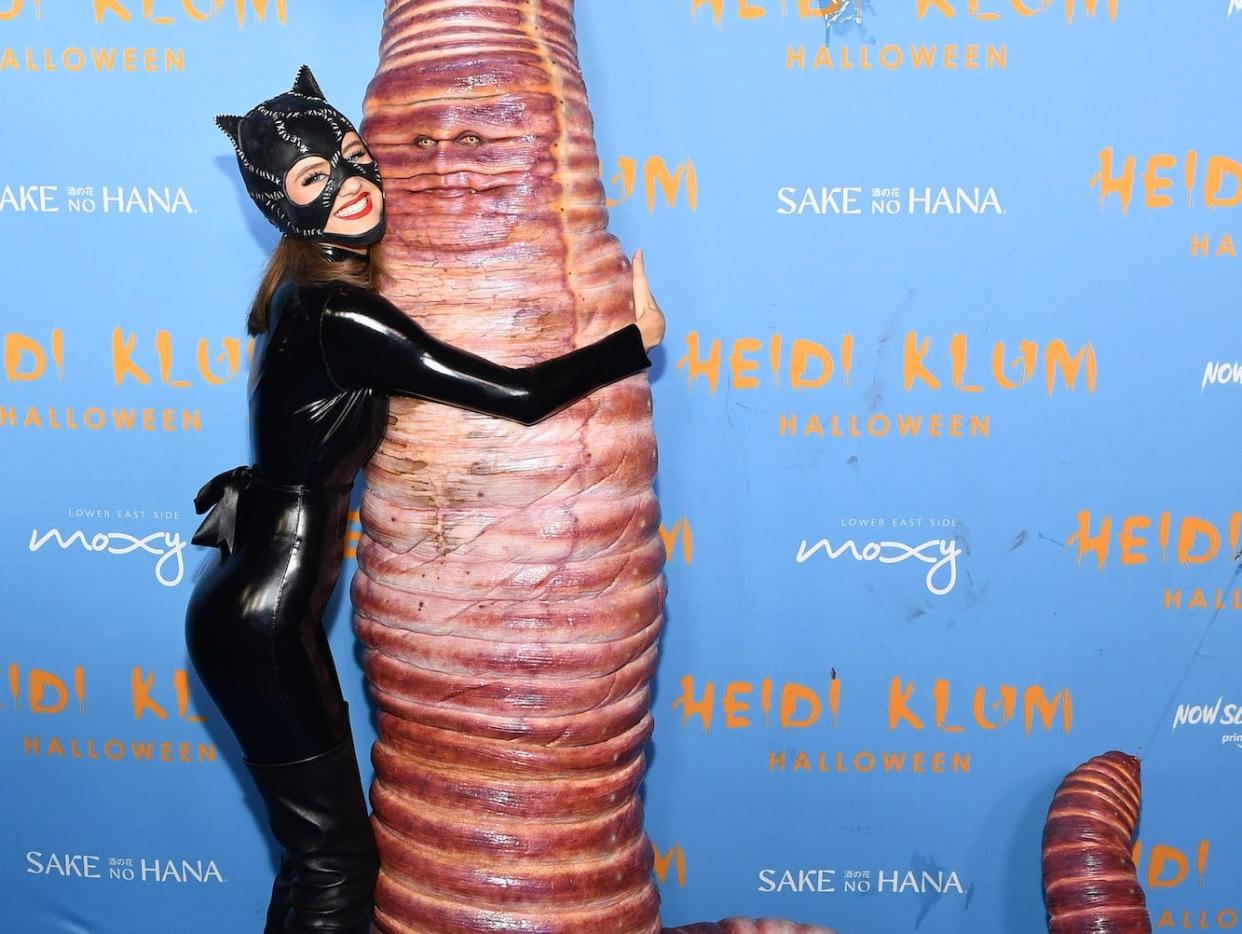 Leni Klum hugs Heidi Klum, who was dressed as a giant worm for Halloween.