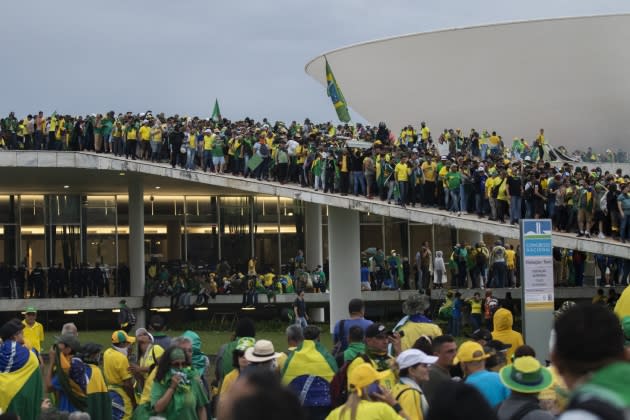 Supporters of former Brazilian President Jair Bolsonaro storm governmental buildings - Credit: Joedson Alves/Anadolu Agency via Getty Images