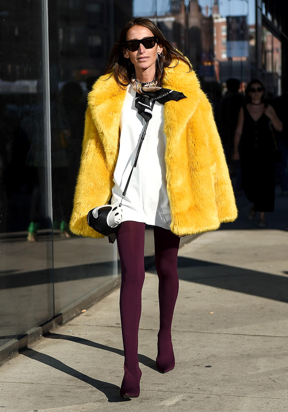 Loulou De Saison bundles up in a yellow fur coat. (Photo: Daniel Zuchnik/Getty Images)