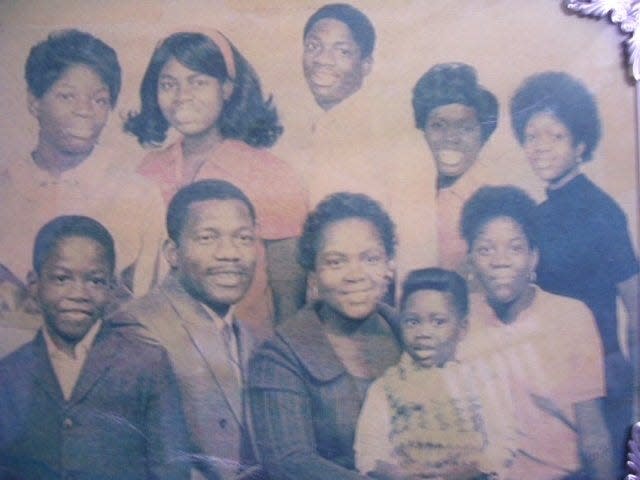 Sherman and Louise Byrd pose with their eight children in this portrait from 1971, a few months before he died. Sherman Byrd joined the Navy in 1947, became a master chief boatswain's mate and the first Black explosive ordnance disposal technician in the service. Cynthia Byrd Conner, who lives in Jacksonville and later wrote a book about her father, is in the back row, far left.
