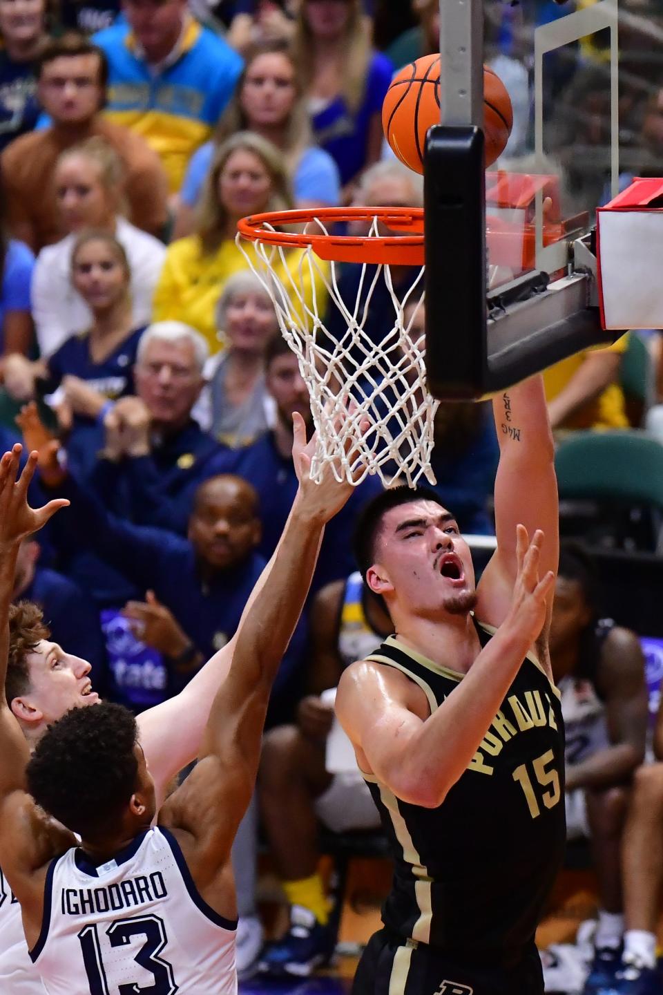 Nov 22, 2023; Honolulu, HI, USA; 

Purdue Boilermakers center Zach Edey (15) shoots a layup while defended by Marquette Golden Eagles forward Oso Ighodaro (13) during the first period at SimpliFi Arena at Stan Sheriff Center. Mandatory Credit: Steven Erler-USA TODAY Sports