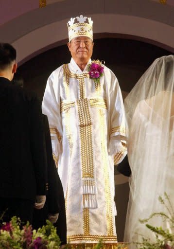 Sun Myung Moon blesses couples during a mass wedding ceremony in Seoul in 2002. Revered by his followers but denounced by critics as a cult-building charlatan, Moon was a deeply divisive figure whose shadowy business and financial dealings saw him jailed in the US