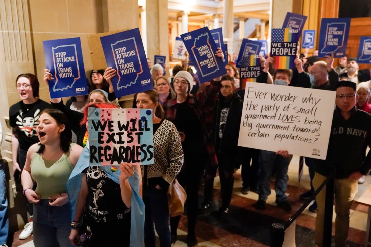 Protesters stand outside of the Senate chamber at the Indiana Statehouse on Feb. 22, 2023, in Indianapolis. The Human Rights Campaign declared a state of emergency for LGBTQ+ people in the U.S. on Tuesday, June 6 and a released a guidebook summarizing what it calls discriminatory laws in each state, along with “know your rights” information and health and safety resources. (AP Photo/Darron Cummings, File) (Copyright 2023 The Associated Press. All rights reserved)