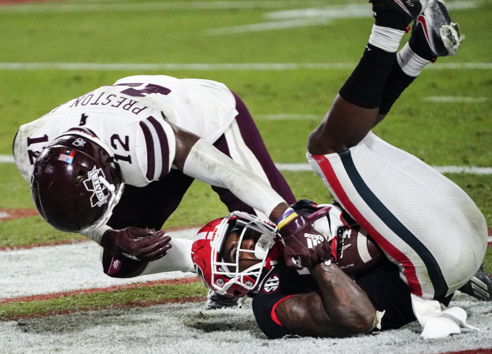 Georgia wide receiver Kearis Jackson scores a touchdown next to Mississippi State safety Shawn Preston Jr. (12) during the second half of an NCAA college football game Saturday, Nov. 21, 2020, in Athens, Ga. (AP Photo/Brynn Anderson)