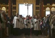 A procession brings the Hungarian relic of St Thomas a Beckett to a ceremony at Westminster Cathedral in London, Britain May 23, 2016. REUTERS/Neil Hall