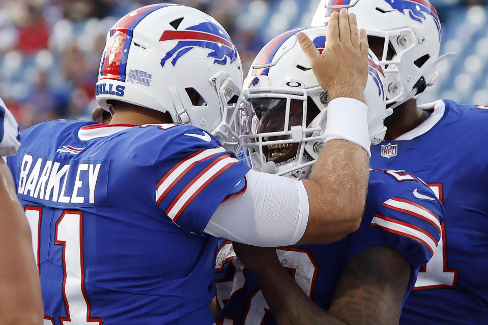 Buffalo Bills quarterback Matt Barkley (11) celebrates with running back Duke Johnson, right, after Johnson scored 2-point conversion in the second half of the team's preseason NFL football game against the Indianapolis Colts, Saturday, Aug. 13, 2022, in Orchard Park, N.Y. The Bills won 27-24. (AP Photo/Jeffrey T. Barnes)