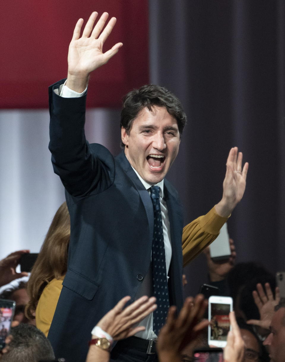 Liberal Leader Justin Trudeau takes the stage at Liberal election headquarters n Montreal, on Tuesday, Oct. 22, 2019. (Paul Chiasson/The Canadian Press via AP)