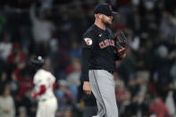 Cleveland Guardians pitcher Ben Lively walks back to the mound, as Boston Red Sox's Connor Wong runs the bases on a home run during the fourth inning of a baseball game Wednesday, April 17, 2024, in Boston. (AP Photo/Charles Krupa)