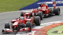 Ferrari Formula One driver Fernando Alonso of Spain drives ahead of team mate Felipe Massa of Brazil during the Italian F1 Grand Prix at the Monza circuit September 8, 2013. REUTERS/Stefano Rellandini (ITALY - Tags: SPORT MOTORSPORT F1)