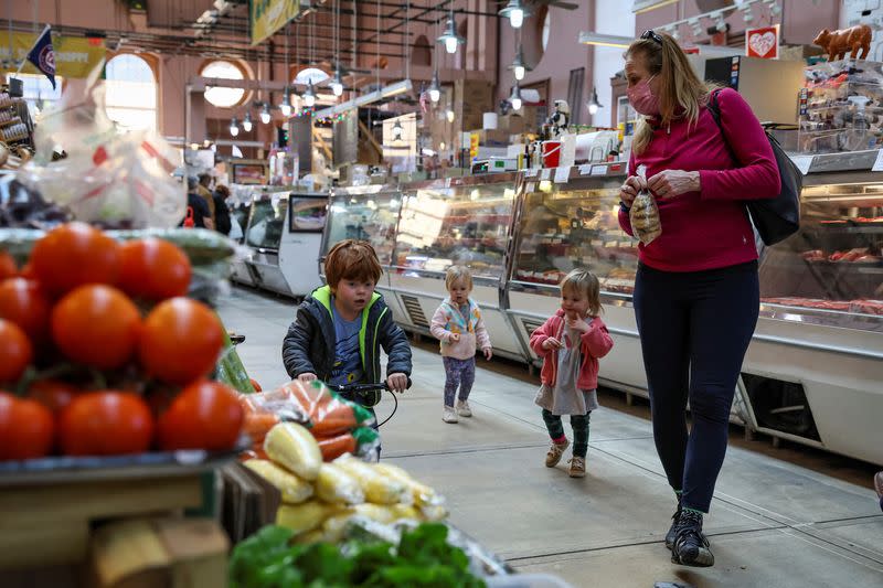 People shop at the Eastern Market in Washington