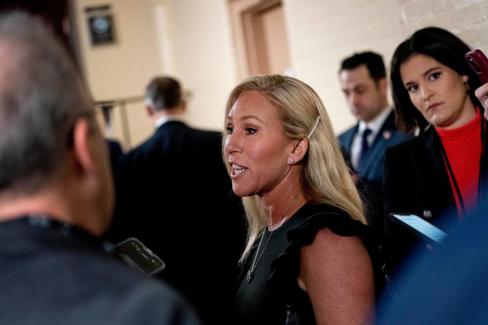 Rep. Marjorie Taylor Greene, R-Ga., arrives for a closed-door meeting with the GOP Conference during opening day of the 118th Congress at the U.S. Capitol in Washington, Tuesday, Jan. 3, 2023.