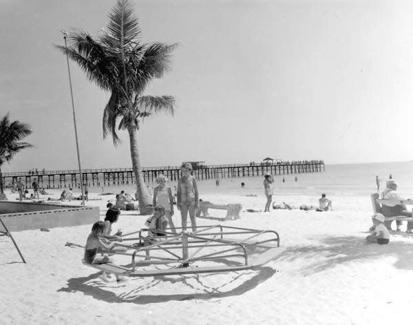 Children playing on merry-go-round at Fort Myers Beach (1961).