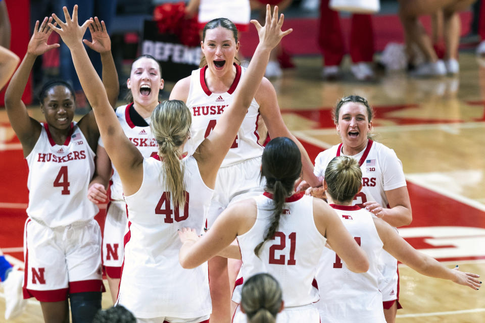 Nebraska players react after defeating Kansas in an NCAA college basketball game on Wednesday, Dec. 21, 2022, at Pinnacle Bank Arena in Lincoln, Neb. (Kenneth Ferriera/Lincoln Journal Star via AP)