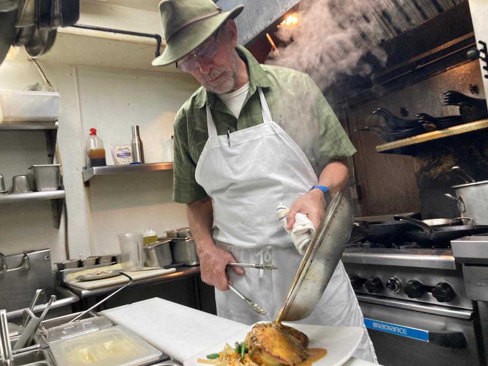 David Hoene, chef/owner at Pauline's Cafe, prepares chicken schnitzel at the South Burlington restaurant Oct. 19, 2023.