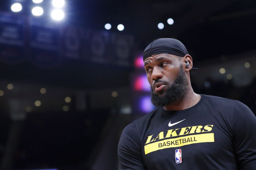 Los Angeles Lakers LeBron James leaves the court after a pre-game workout before the start.