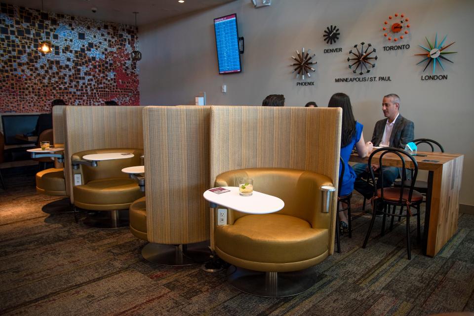 Rows of group and individual seating inside the Escape Lounge in Terminal 3 at Sky Harbor Airport in Phoenix on Nov. 9, 2021.