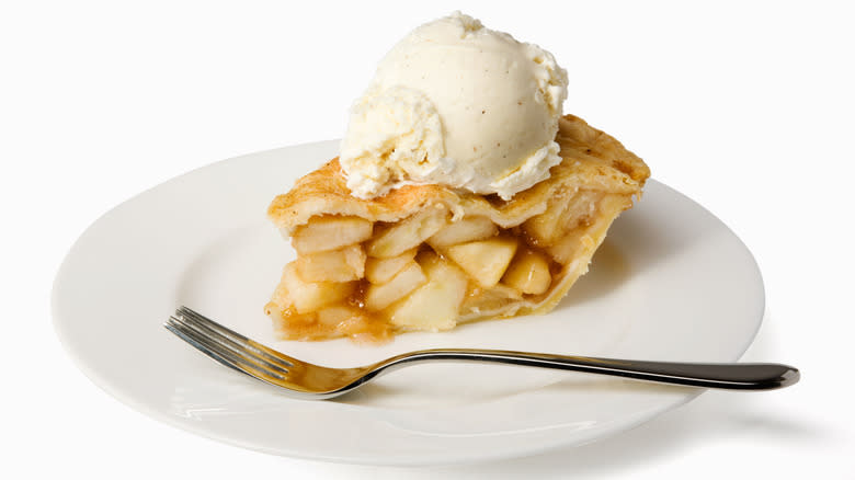 Apple pie a la mode on white plate