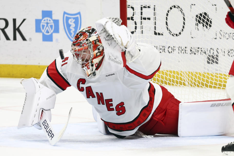 Carolina Hurricanes goaltender Spencer Martin sprawls to make a save during the first period of an NHL hockey game against the Buffalo Sabres, Sunday, Feb. 25, 2024, in Buffalo, N.Y. (AP Photo/Jeffrey T. Barnes)