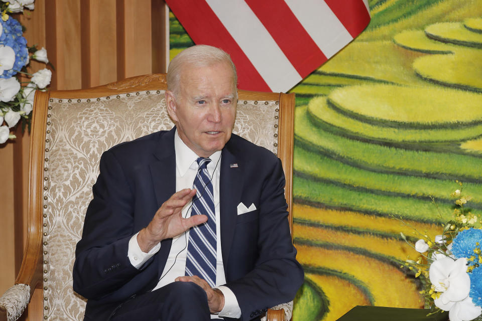 U.S. President Joe Biden speaks to Vietnamese Prime Minister Pham Minh Chinh during their meeting at the Government Office in Hanoi, Vietnam Monday, Sept. 11, 2023. (AP Photo/Minh Hoang, Pool)