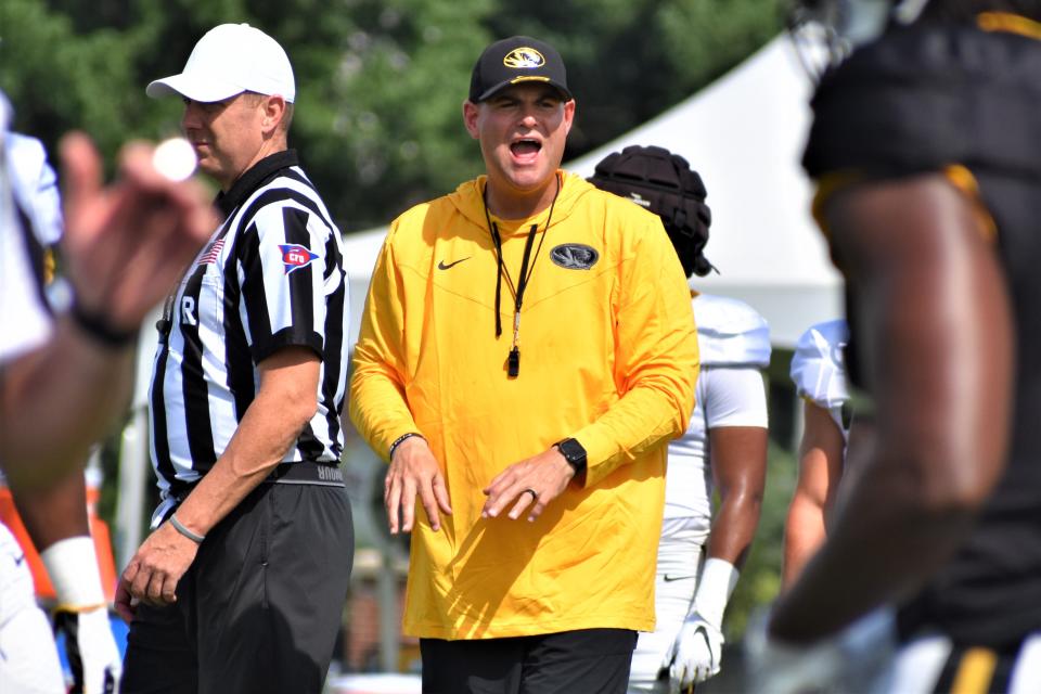 Missouri wide receivers coach Jacob Peeler yells out instructions during the Tigers' preseason camp practice at the Kadlec Practice Fields on Sunday, Aug. 7, 2022.