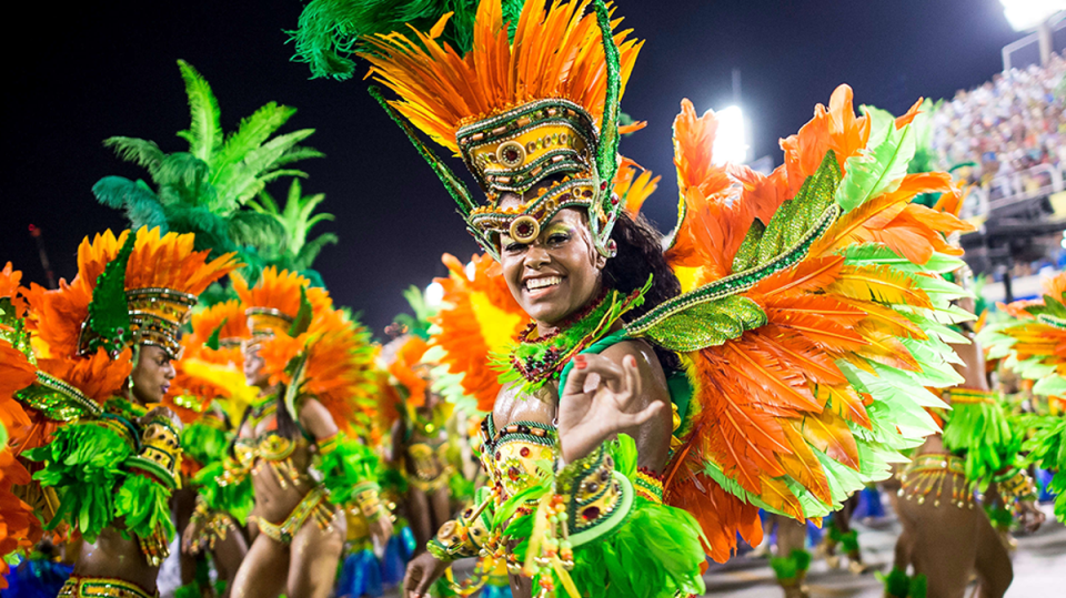 Expect a sea of costumes, colour and caipirinha cocktails (Buda Mendes/Getty Images)