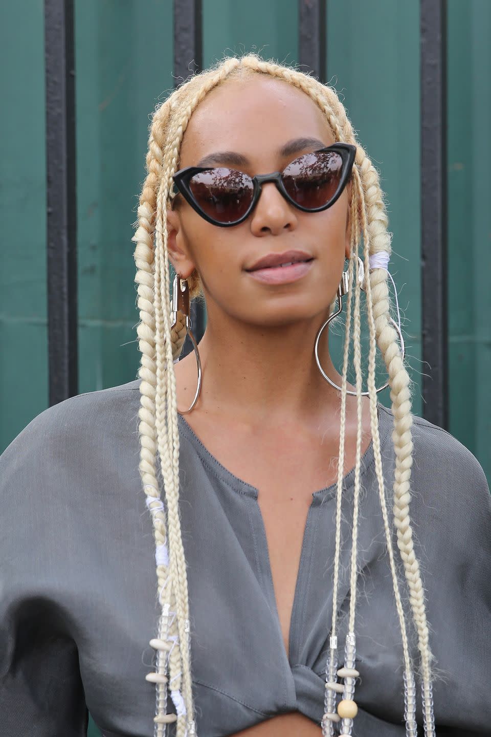 <p>The singer worked extra long bleached blonde braids.</p>