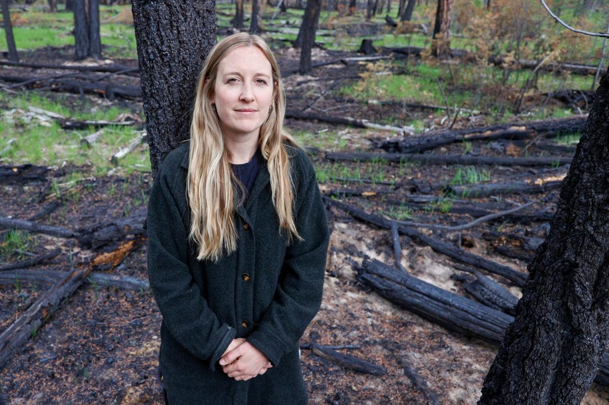 Kiah Allen, a cultural and prescribed fire research and capacity lead for the BC Wildfire Service stands inside a forest that recently went thorough a prescribed burn in Kimberley, British Columbia, Canada on May, 30, 2024.