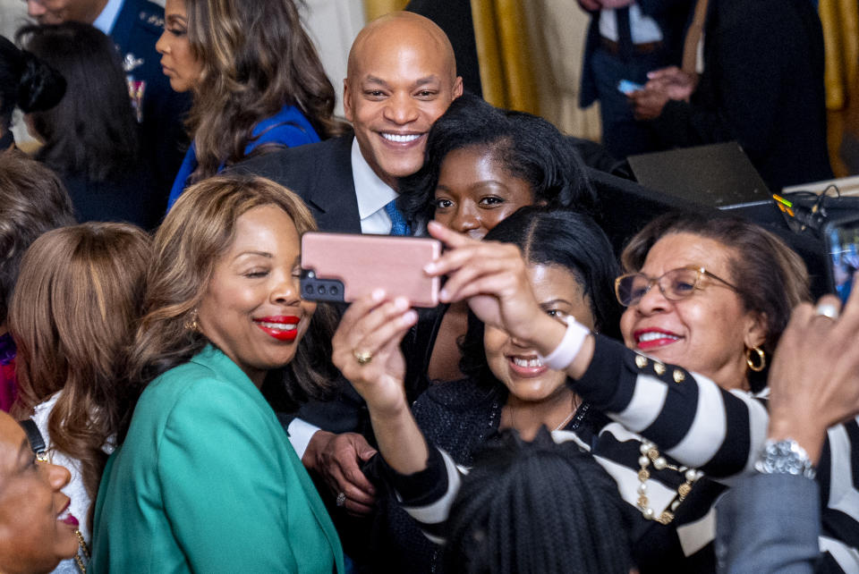 Maryland Gov. Wes Moore takes a photo with guests at a reception in recognition of Black History Month in the East Room of the White House in Washington, Tuesday, Feb. 6, 2024. (AP Photo/Andrew Harnik)