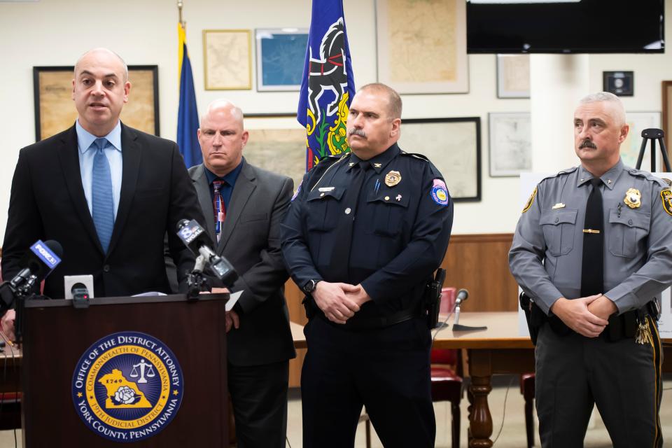 (From right) Police chiefs Chad Martin (Hanover Borough), Guy Hettinger (Penn Township) and Dave Lash (Northern York County Regional) listen as York County District Attorney Dave Sunday speaks during a press conference at the Hanover Borough Municipal Building on Wednesday, Oct. 11, 2023. Members of the Pennsylvania State Police and the Federal Bureau of Investigation were also present.