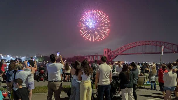 PHOTO: Spectators watch fireworks explode during the Central Astoria annual Independence Day Celebrations fireworks display in Astoria Park on June 29, 2023, in New York. (Ron Adar/Shutterstock)