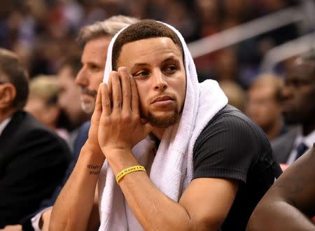 Dec 5, 2015; Toronto, Ontario, CAN; Golden State Warriors guard Stephen Curry (30) sits on the bench during the Warriors 112-109 win over Toronto Raptors at Air Canada Centre. Mandatory Credit: Dan Hamilton-USA TODAY Sports