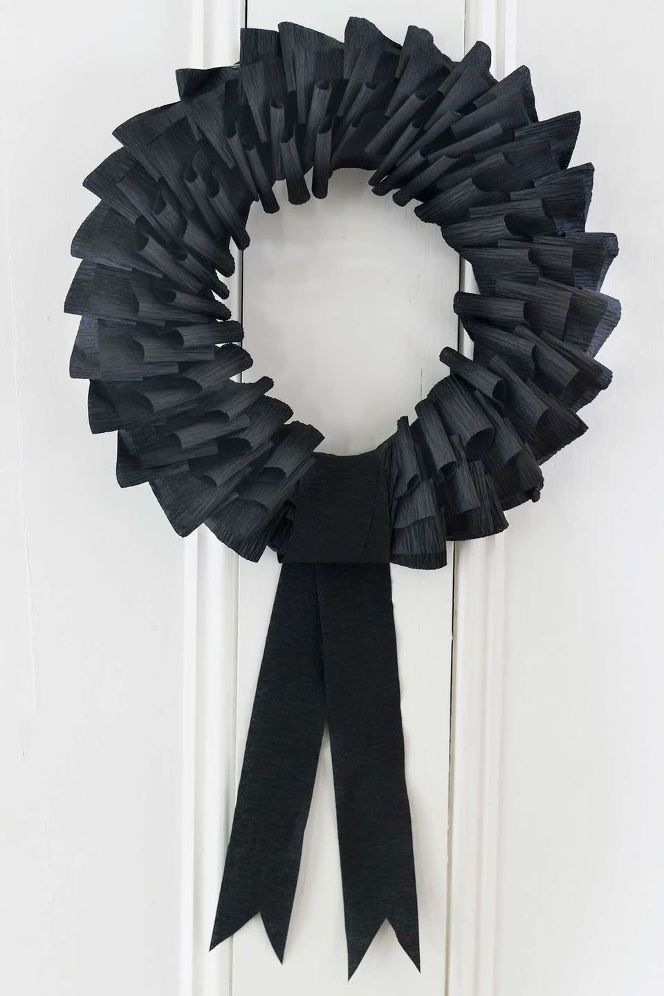 <p>This eery wreath is as simple as folding black streamers around a foam wreath form. Once you make the basic wreath, you can decorate it with plastic spiders, bats, or whatever creepy crawlies you'd like. </p><p><a class="link " href="https://www.amazon.com/Creative-Converting-Streamer-81-Foot-Velvet/dp/B000VO756C/ref=sr_1_3?tag=syn-yahoo-20&ascsubtag=%5Bartid%7C10055.g.4602%5Bsrc%7Cyahoo-us" rel="nofollow noopener" target="_blank" data-ylk="slk:SHOP CREPE STREAMERS;elm:context_link;itc:0;sec:content-canvas">SHOP CREPE STREAMERS</a></p><p><em><a href="https://www.countryliving.com/diy-crafts/how-to/g1026/how-to-make-a-paper-wreath-1010/" rel="nofollow noopener" target="_blank" data-ylk="slk:Get the tutorial at Country Living »;elm:context_link;itc:0;sec:content-canvas" class="link ">Get the tutorial at Country Living <em>»</em></a></em></p>