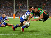 Alex Johnston takes flight to open the scoring for Souths.