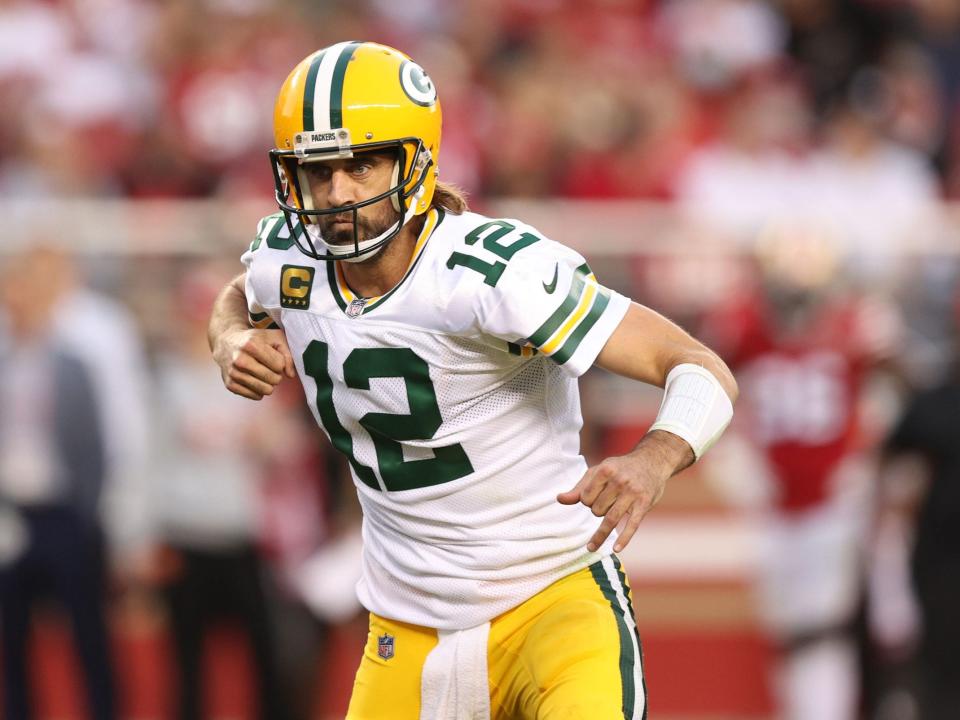 Aaron Rodgers celebrates a touchdown against the 49ers.