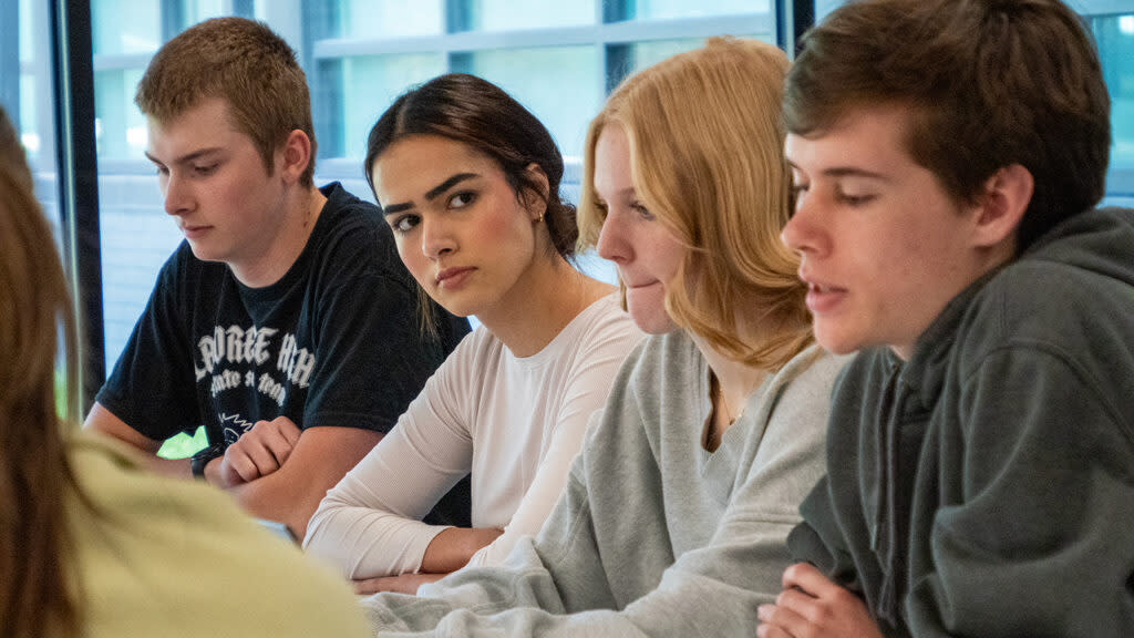 From left, Lawrence High School senior journalism students Jack Tell, Natasha Torkzaban, Maya Smith and Morgan Salisbury present policy recommendations during an April 19, 2024, meeting with the district school board president