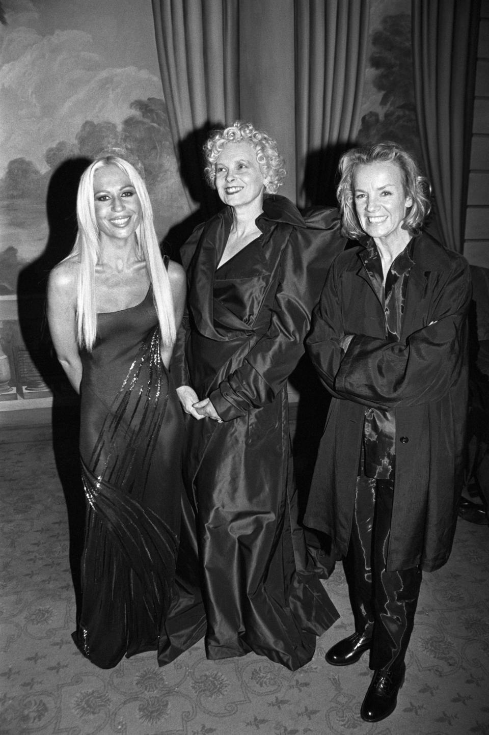 Fashion designers Donatella Versace, Vivienne Westwood and Jil Sander pose and smile at an event in New York where they receieved "Fashion Legend" awards (Photo by Nick Machalaba/WWD/Penske Media via Getty Images)