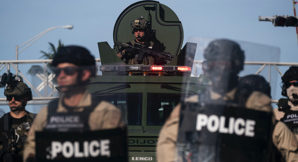 A Miami Police officer watches protestors from a armored vehicle during a rally in response to the recent death of George Floyd in Miami, Florida on May 31, 2020. (Photo: RICARDO ARDUENGO/AFP via Getty Images)