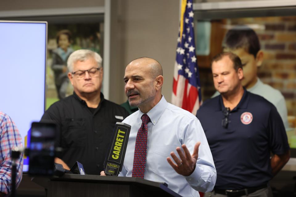 Leon County Schools Superintendent Rocky Hanna holds up a handheld metal detector at a press conference at the district's safety and security portable on Tuesday, Dec. 6, 2022.