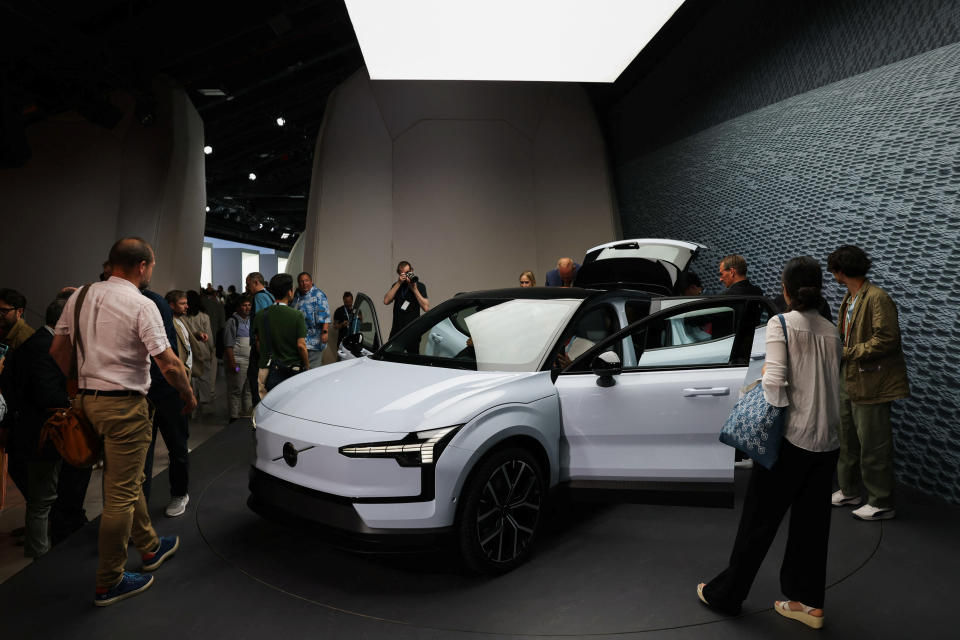 People look on during the reveal event of the Volvo EX30 electric SUV vehicle in Milan, Italy June 7, 2023. REUTERS/Claudia Greco