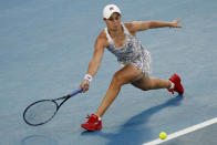 Ash Barty of Australia plays a forehand return to Camila Giorgi of Italy during their third round match at the Australian Open tennis championships in Melbourne, Australia, Friday, Jan. 21, 2022. (AP Photo/Hamish Blair)