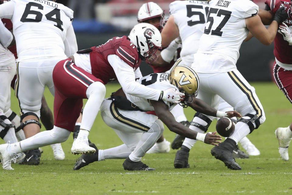 Vanderbilt running back Chase Gillespie (13) and South Carolina defensive lineman Elijah Davis (11) try to recover a fumble during the second half of an NCAA college football game on Saturday, Nov. 11, 2023, in Columbia, S.C. (AP Photo/Artie Walker Jr.)